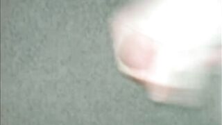 A guy masturbates his big dick until he comes
