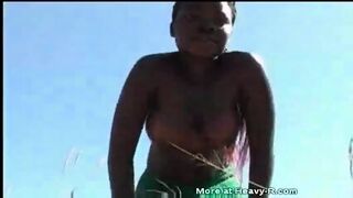 Hot ebony teen dances naked in the park